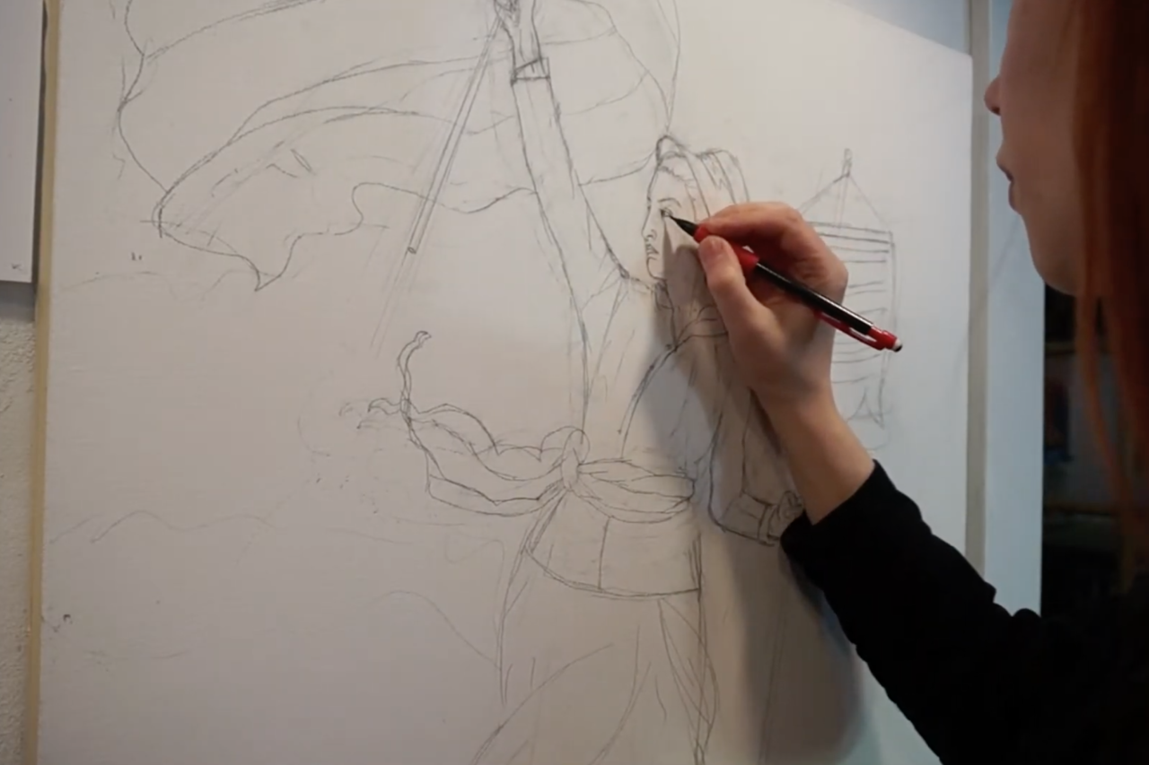 Image of artist working on artwork.